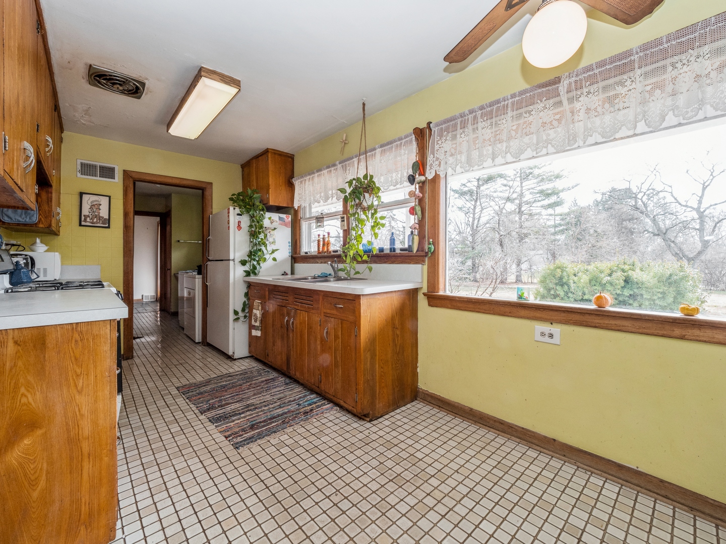 1762 West Palatine Road Palatine, IL 60067 - Photo 6 of 13 a view of a kitchen with furniture and a window