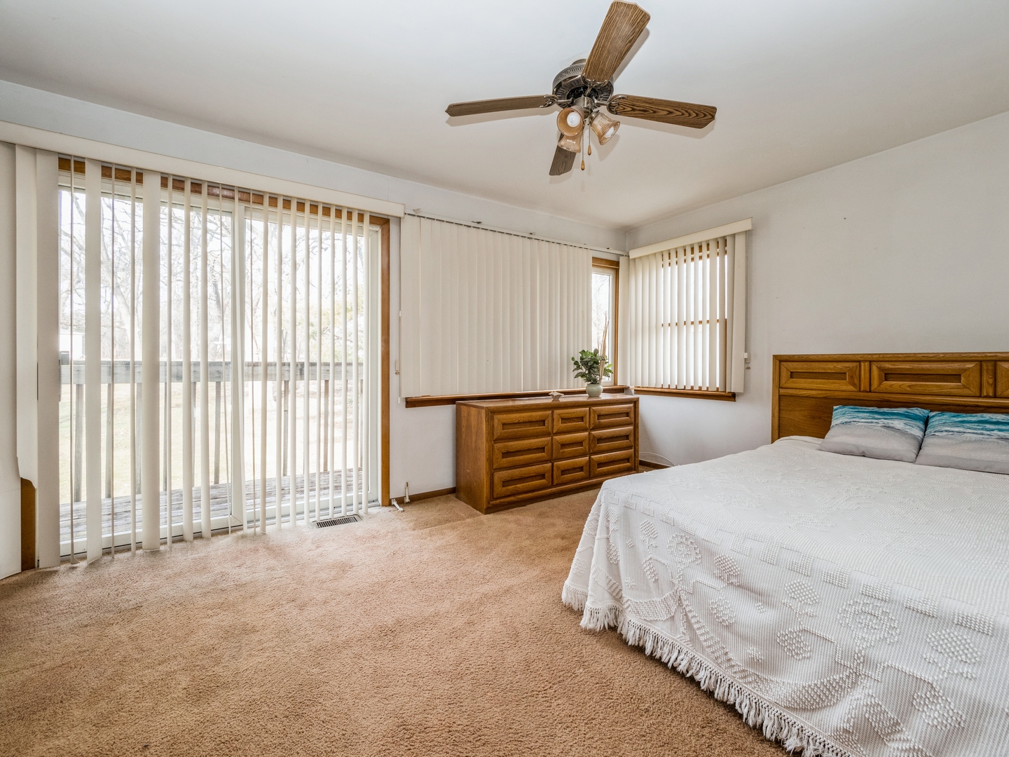 1762 West Palatine Road Palatine, IL 60067 - Photo 7 of 13 a spacious bedroom with a bed and a chandelier