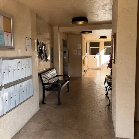 a room with lots of wooden furniture and windows
