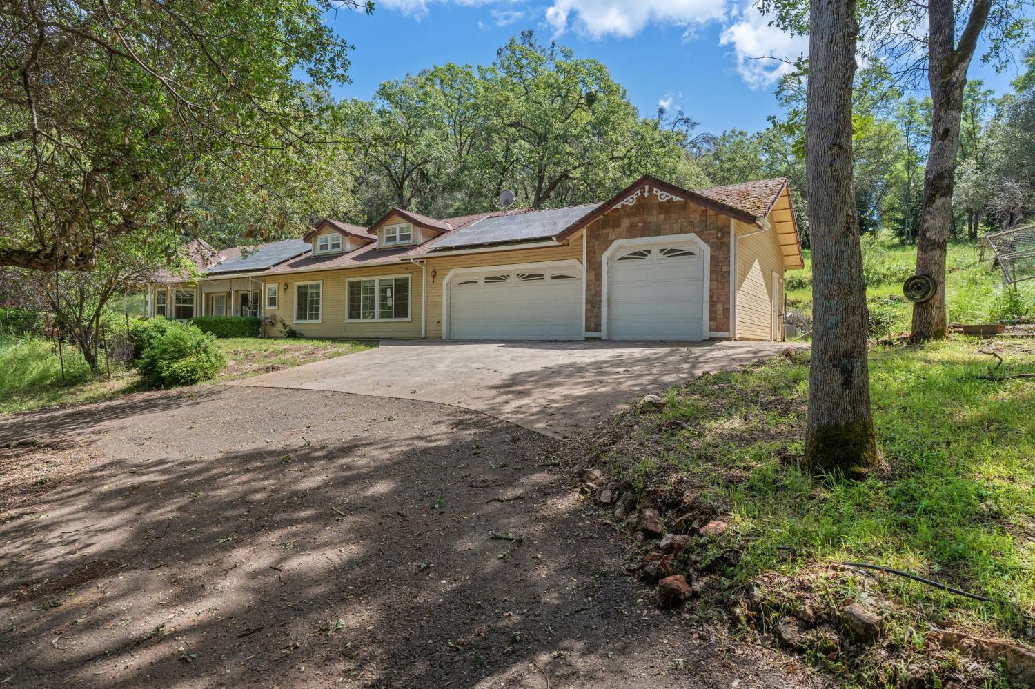 a house with a tree in front of it