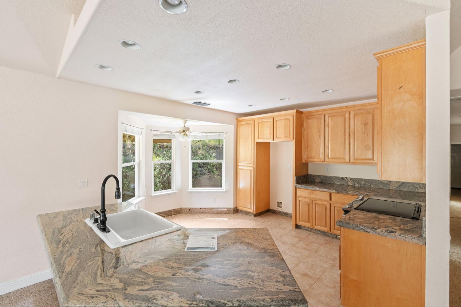 4410 Rossler Road Placerville, CA 95667 - Photo 12 of 35 a view of a kitchen with a sink and a window