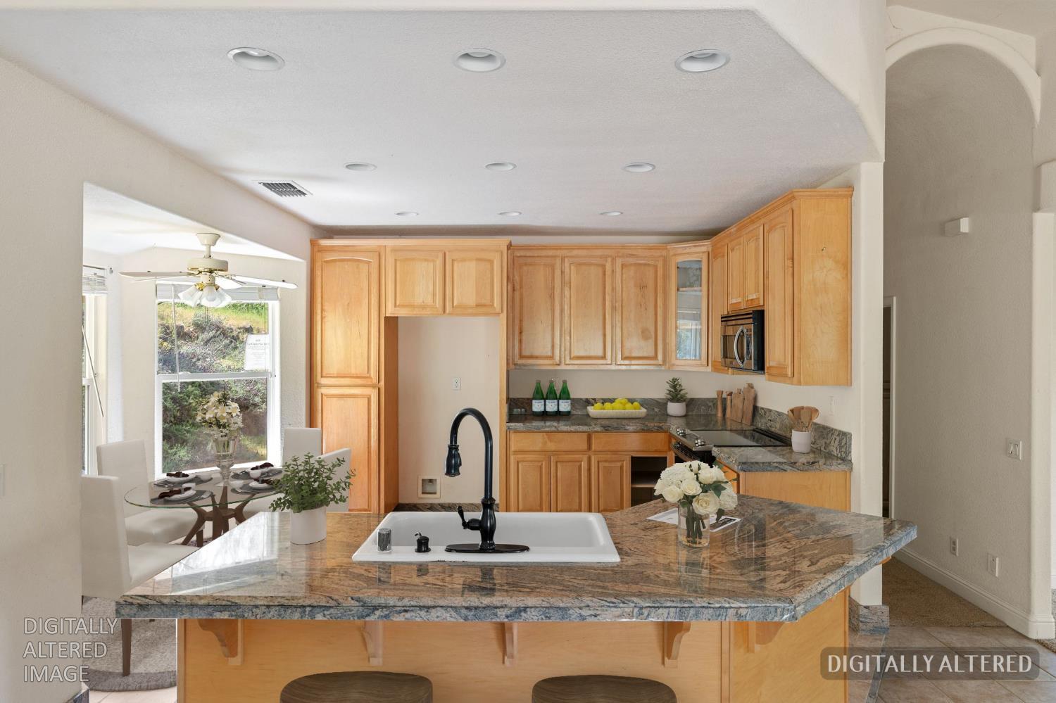 4410 Rossler Road Placerville, CA 95667 - Photo 13 of 35 a kitchen with kitchen island granite countertop a sink and a counter top space