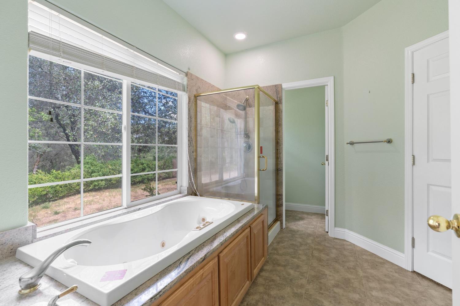 4410 Rossler Road Placerville, CA 95667 - Photo 23 of 35 a bathroom with a tub sink and shower