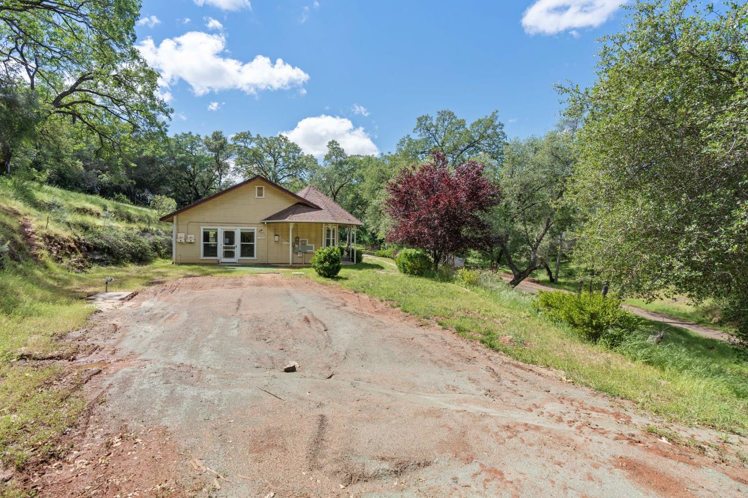 4410 Rossler Road Placerville, CA 95667 - Photo 34 of 35 a house with green field in front of it