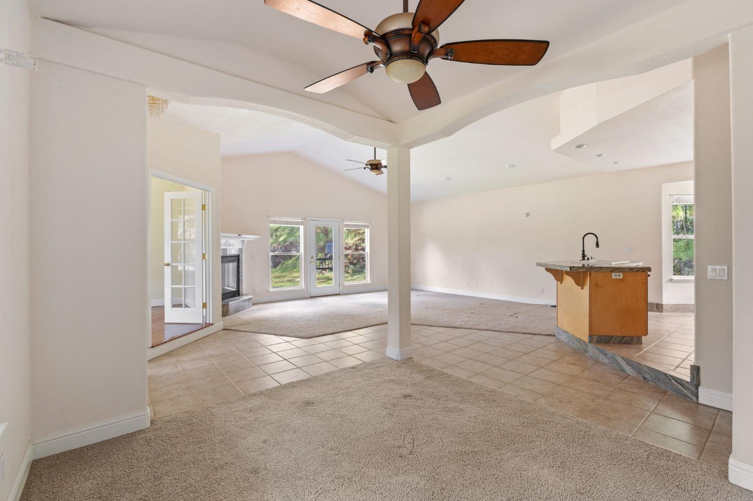 4410 Rossler Road Placerville, CA 95667 - Photo 7 of 35 a view of a livingroom with a chandelier fan and windows
