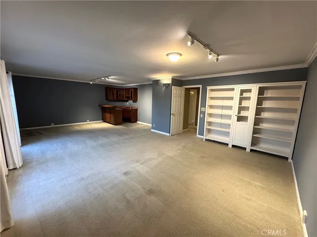 a view of an empty room with a fireplace