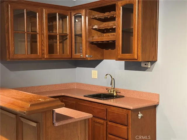 a kitchen with a sink and cabinets