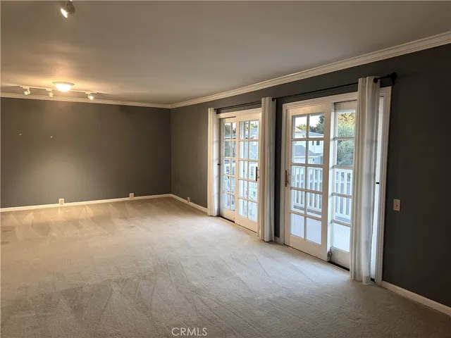 a view of an empty room with a balcony
