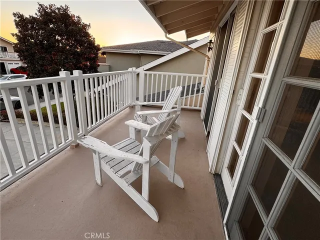 a view of balcony with wooden floor and stairs