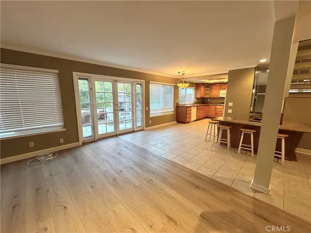 a big room with wooden floor and furniture