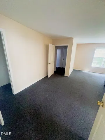 a view of empty room with windows