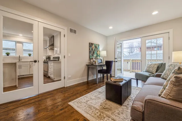 a view of a dining room with furniture and wooden floor