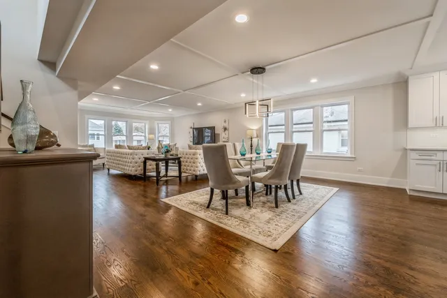 a living room with furniture a flat screen tv and a window