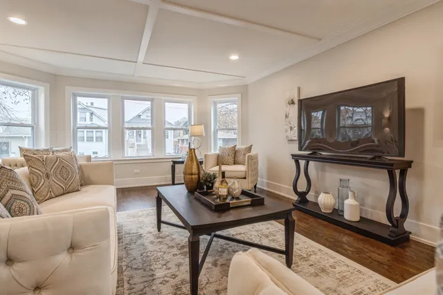 a kitchen with stainless steel appliances granite countertop a lot of counter space and wooden floor