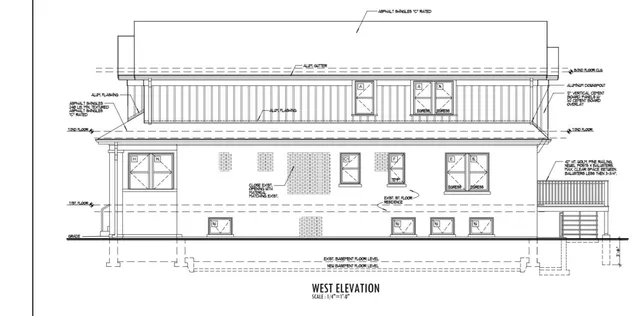 a black and white photo of a living room