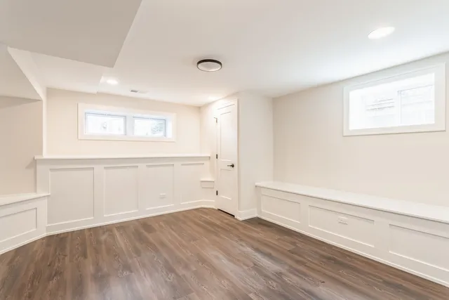 an empty room with wooden floor