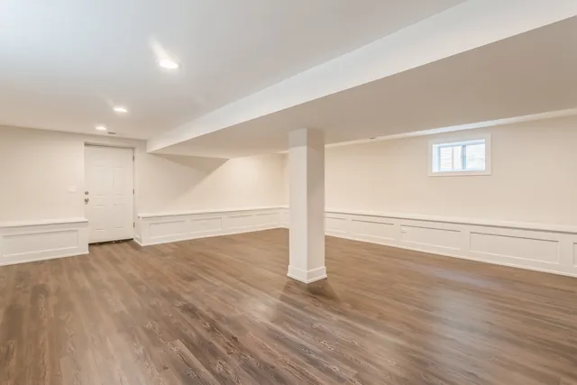 a bathroom with a granite countertop sink a toilet and shower