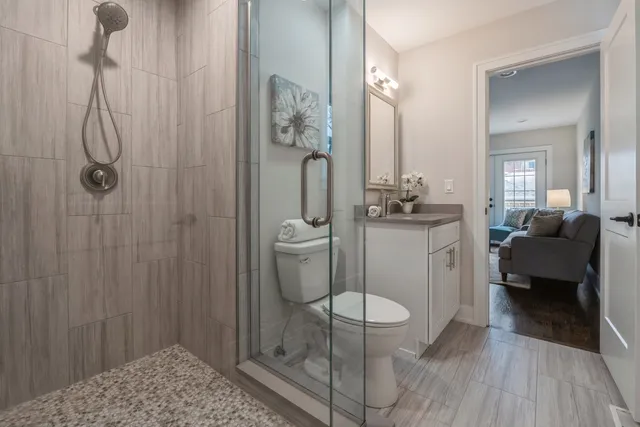 a bathroom with a sink toilet and shower