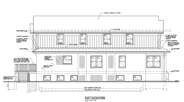 a black and white photo of a living room