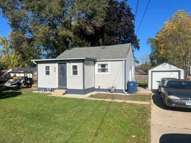 a house that has sitting area in front of it
