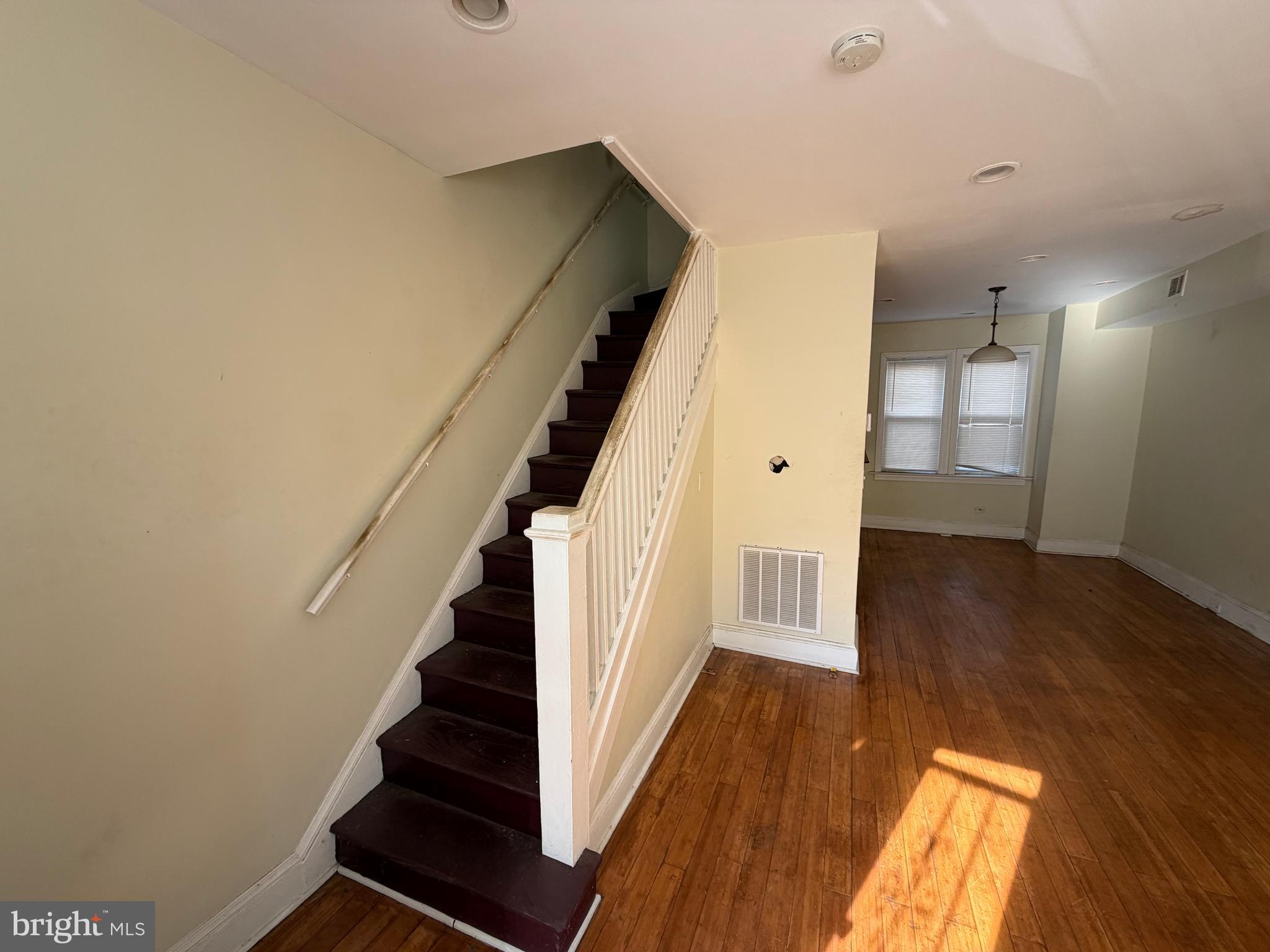 130 16th Street Northeast Washington, DC 20002 - Photo 2 of 24 a view of a hallway with wooden floor and staircase
