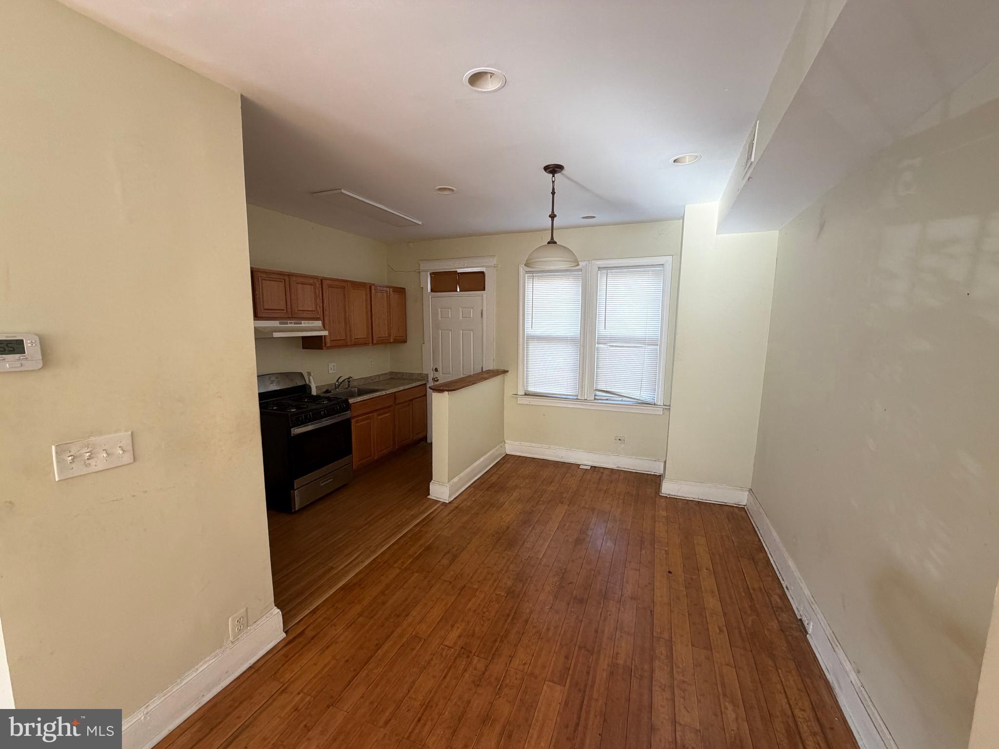 130 16th Street Northeast Washington, DC 20002 - Photo 5 of 24 a kitchen with wooden floors and appliances