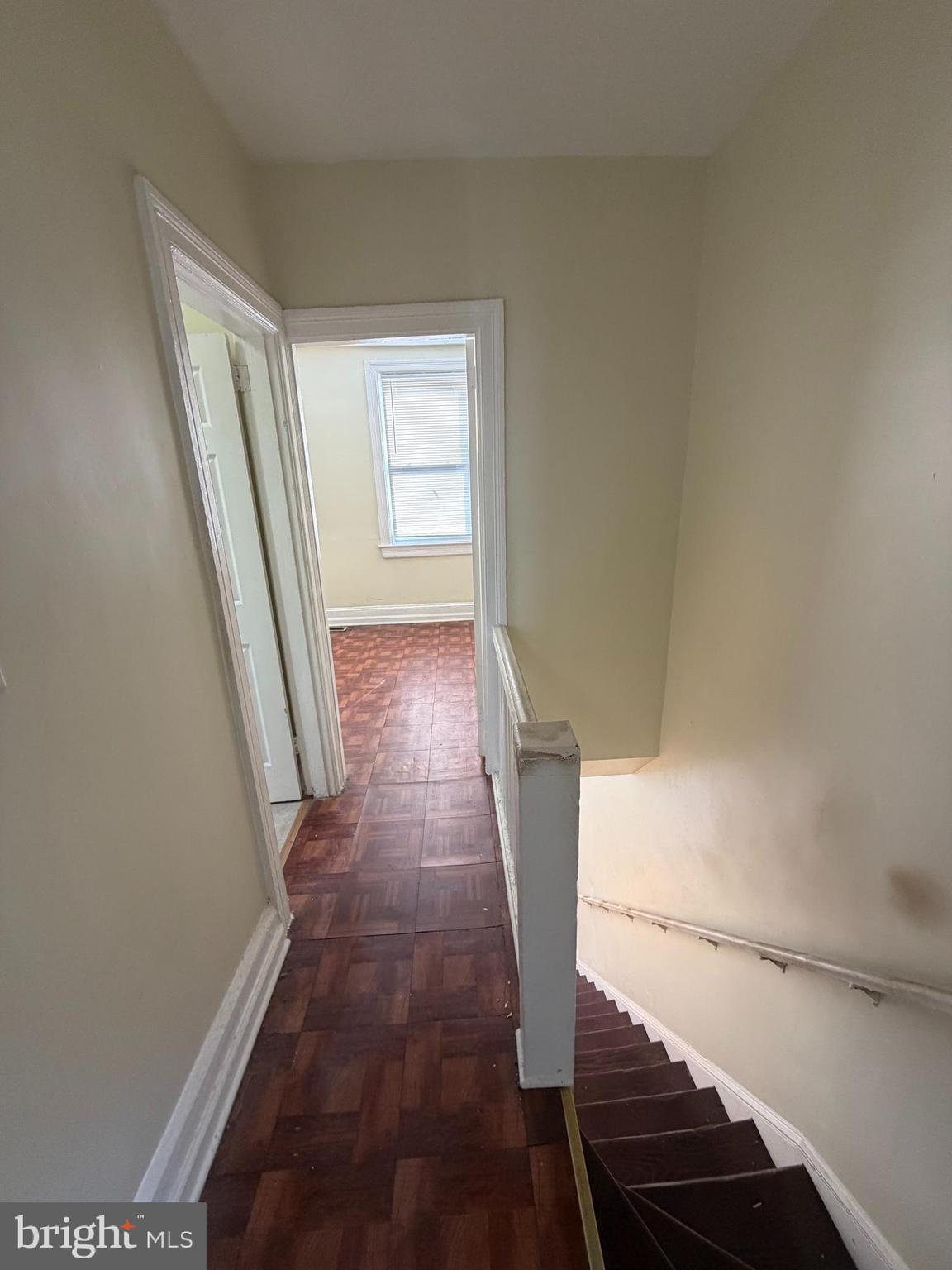 130 16th Street Northeast Washington, DC 20002 - Photo 8 of 24 a view of a hallway with wooden floor and staircase