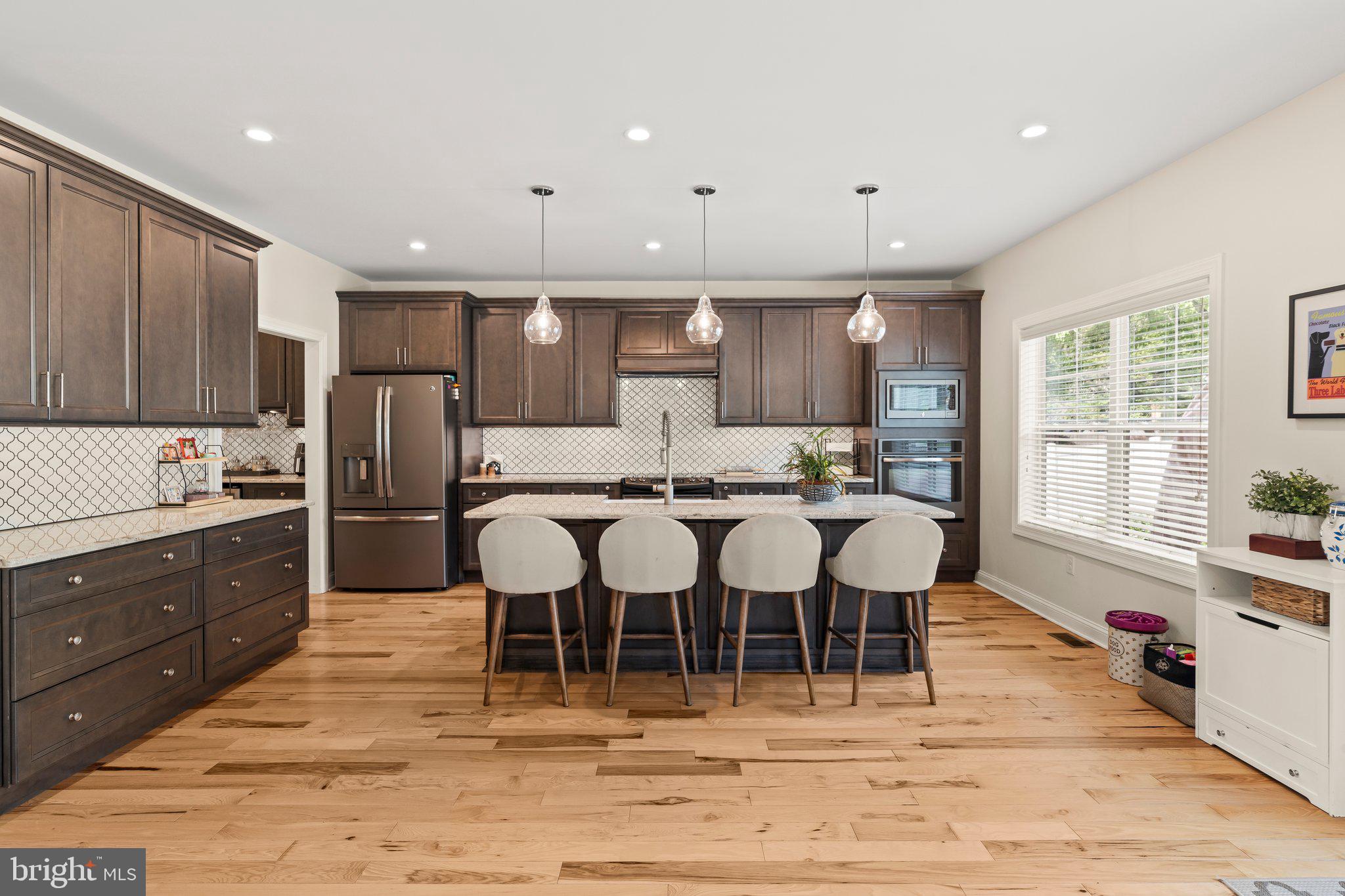 1413 Cortez Road Blue Bell, PA 19422 - Photo 14 of 66 a large kitchen with a table and chairs