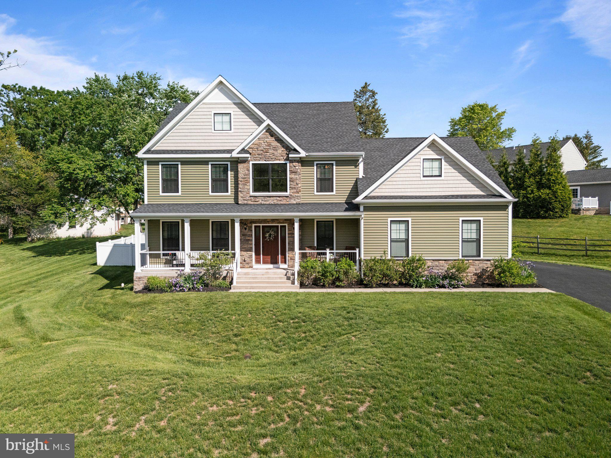 1413 Cortez Road Blue Bell, PA 19422 - Photo 2 of 66 a front view of a house with a garden