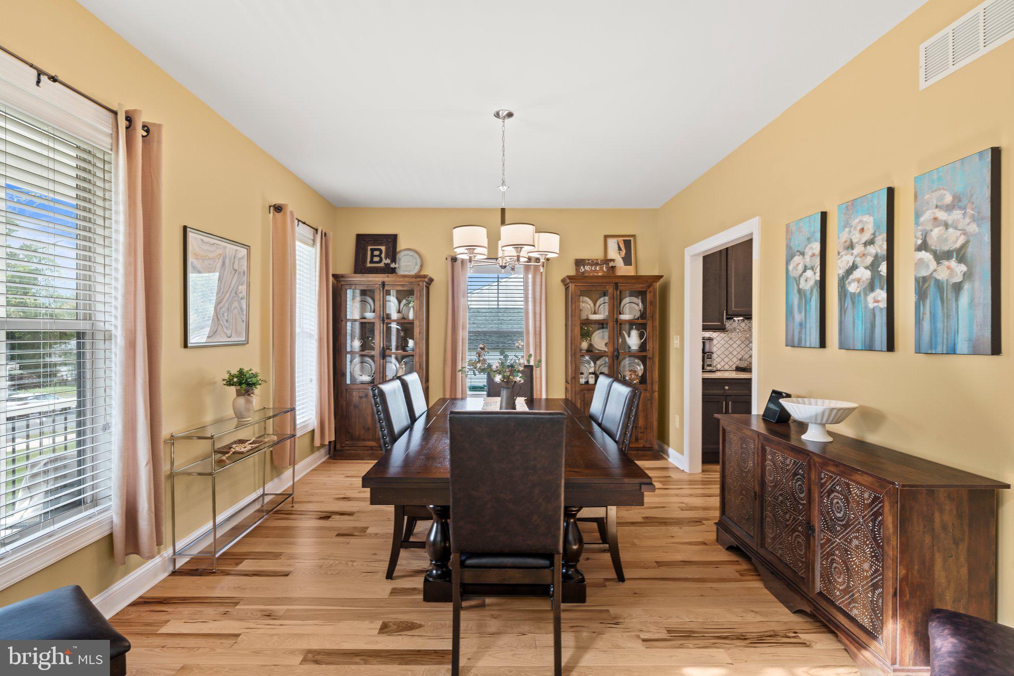 1413 Cortez Road Blue Bell, PA 19422 - Photo 22 of 66 a view of a dining room with furniture window and wooden floor