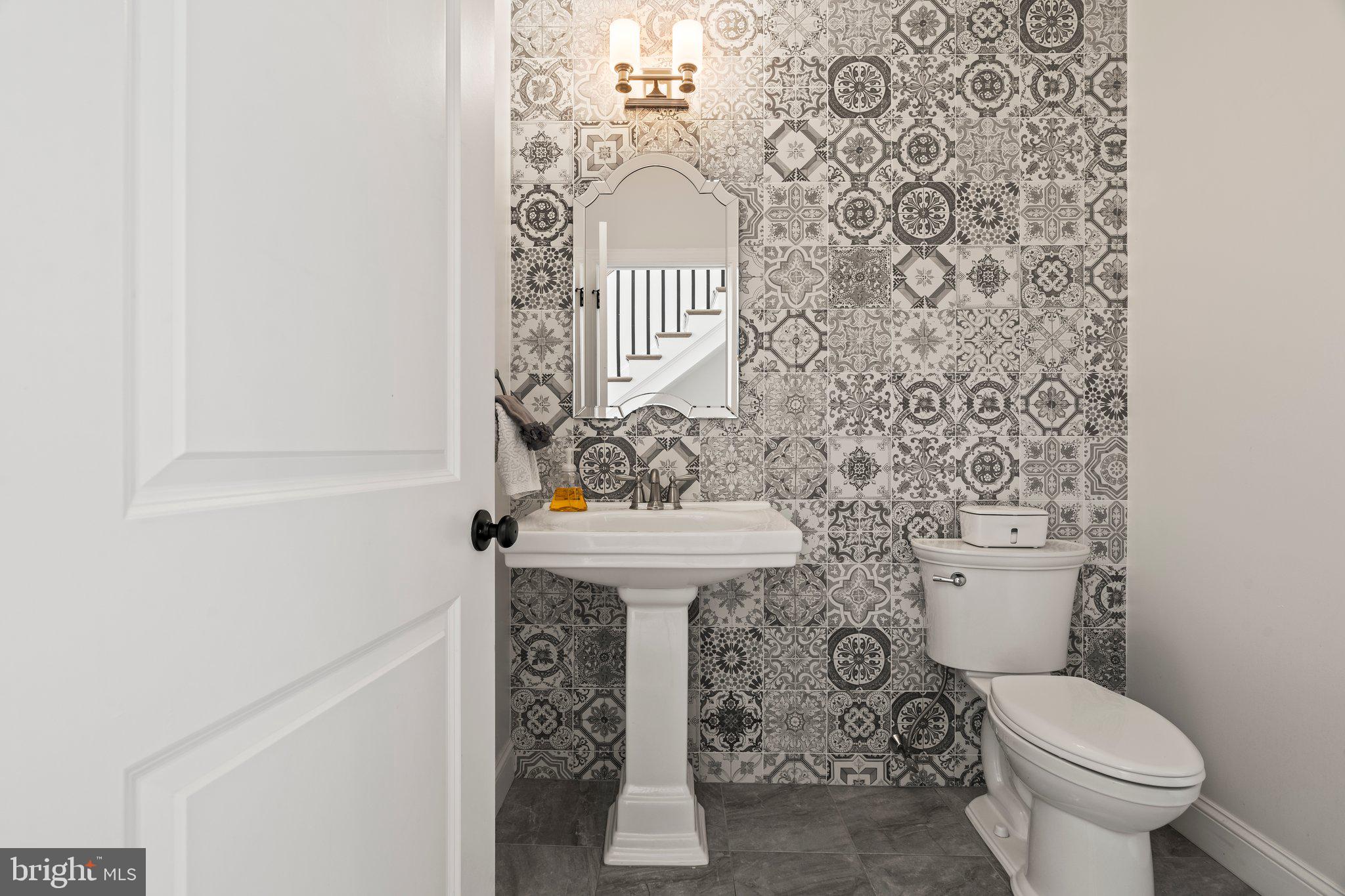 1413 Cortez Road Blue Bell, PA 19422 - Photo 24 of 66 a bathroom with a sink a toilet and mirror