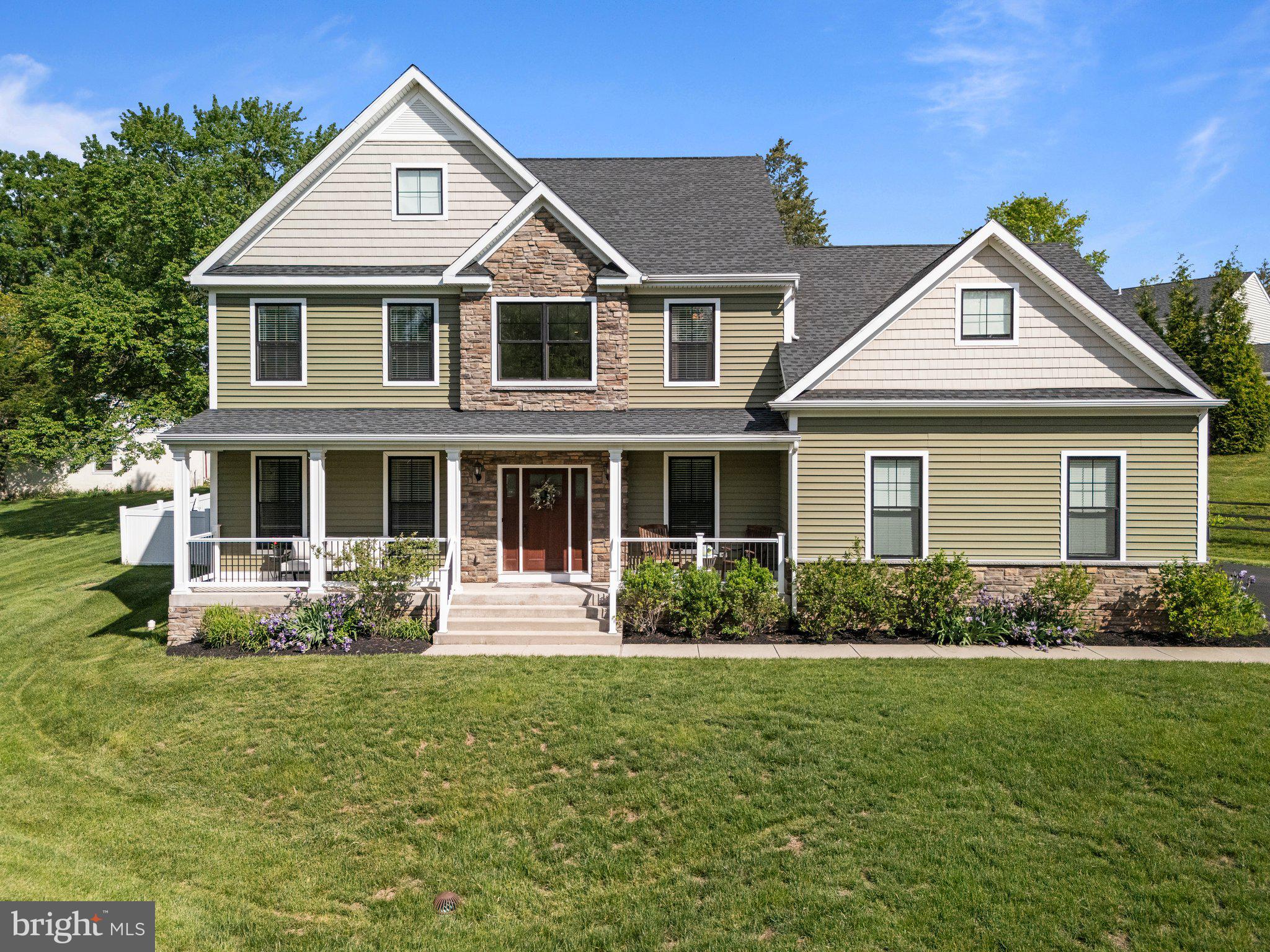 1413 Cortez Road Blue Bell, PA 19422 - Photo 3 of 66 a front view of a house with garden