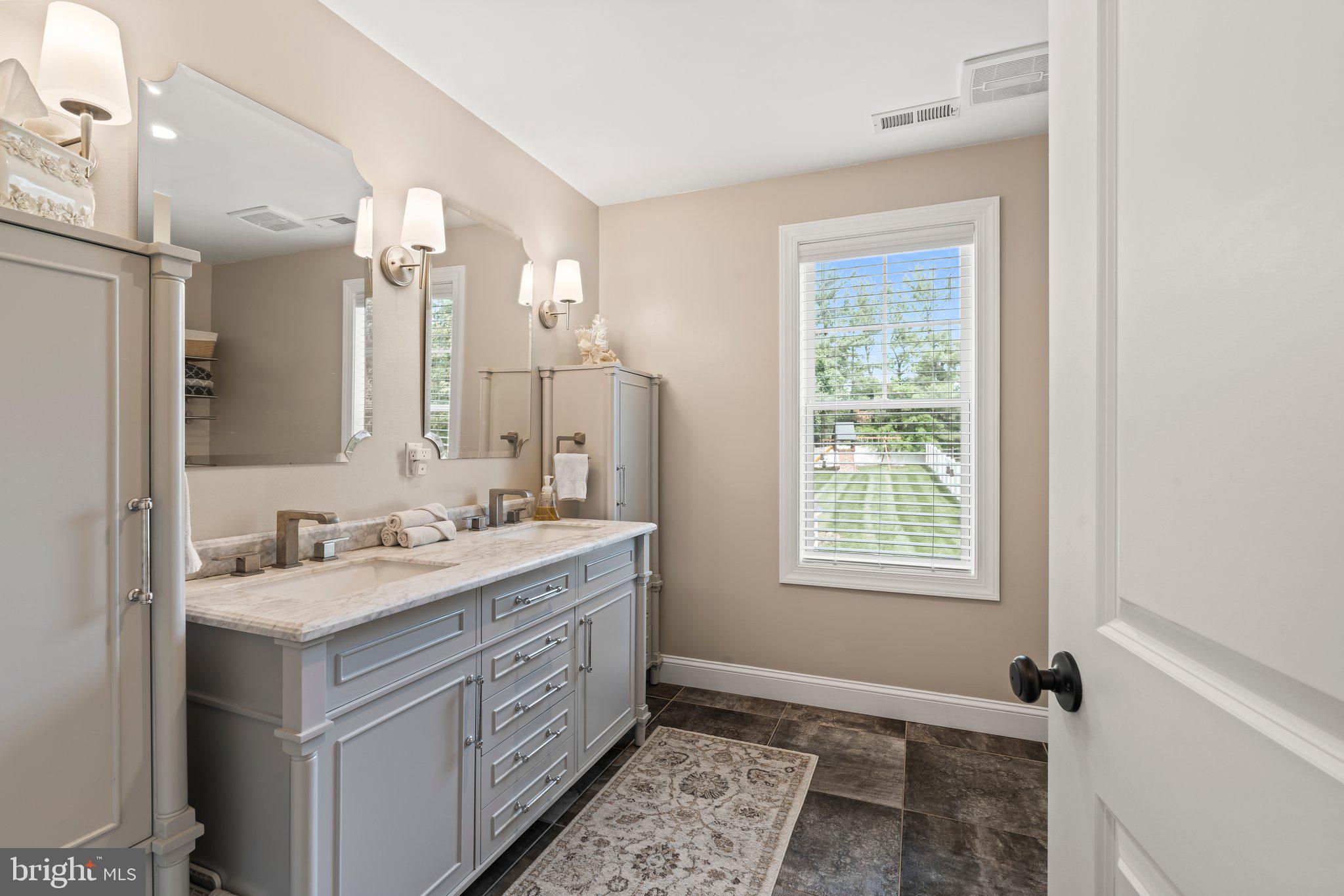 1413 Cortez Road Blue Bell, PA 19422 - Photo 31 of 66 a bathroom with a sink double vanity granite and a mirror
