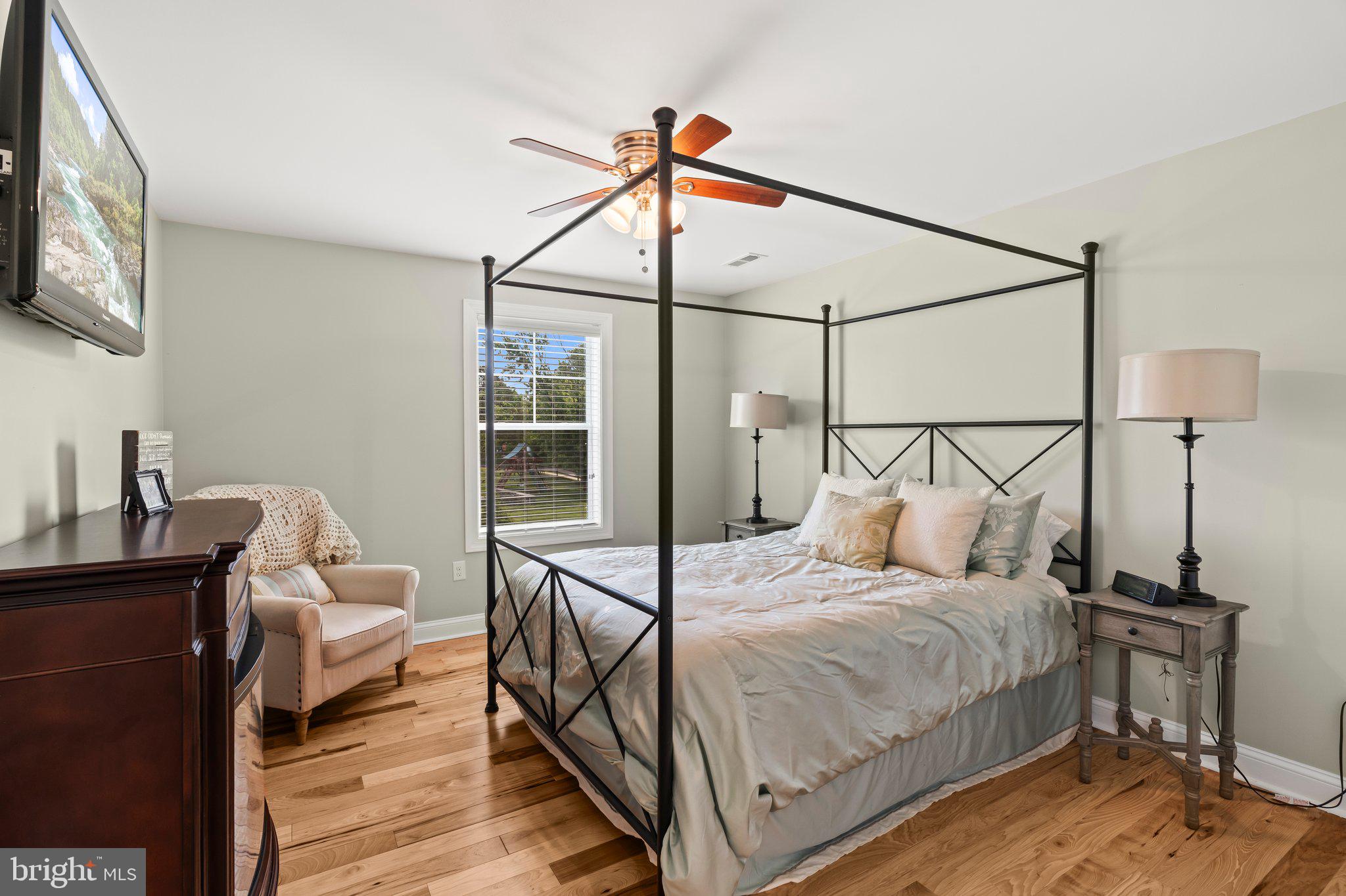 1413 Cortez Road Blue Bell, PA 19422 - Photo 35 of 66 a bedroom with a bed and wooden floor