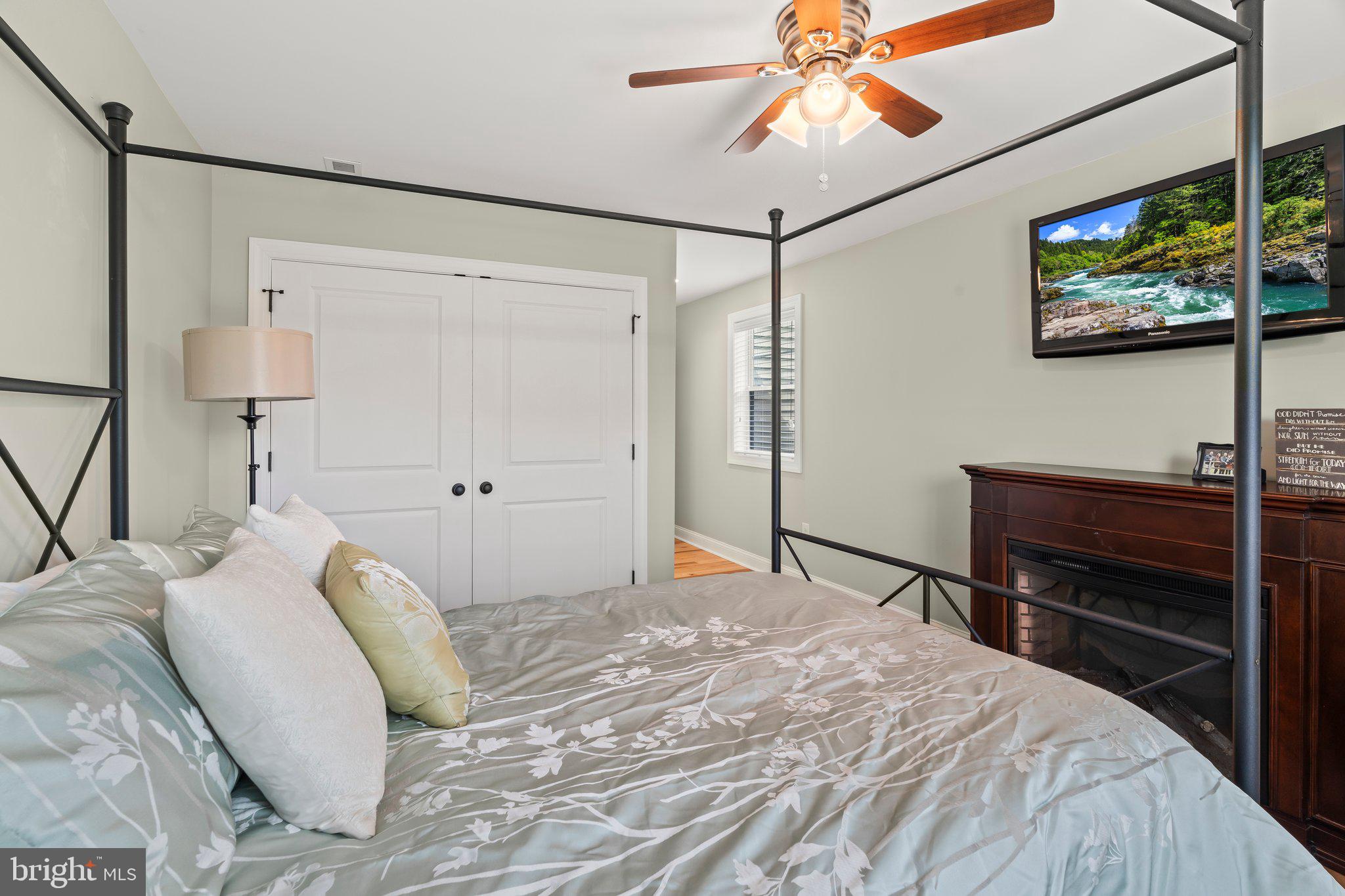 1413 Cortez Road Blue Bell, PA 19422 - Photo 36 of 66 a bedroom with a bed and a chandelier