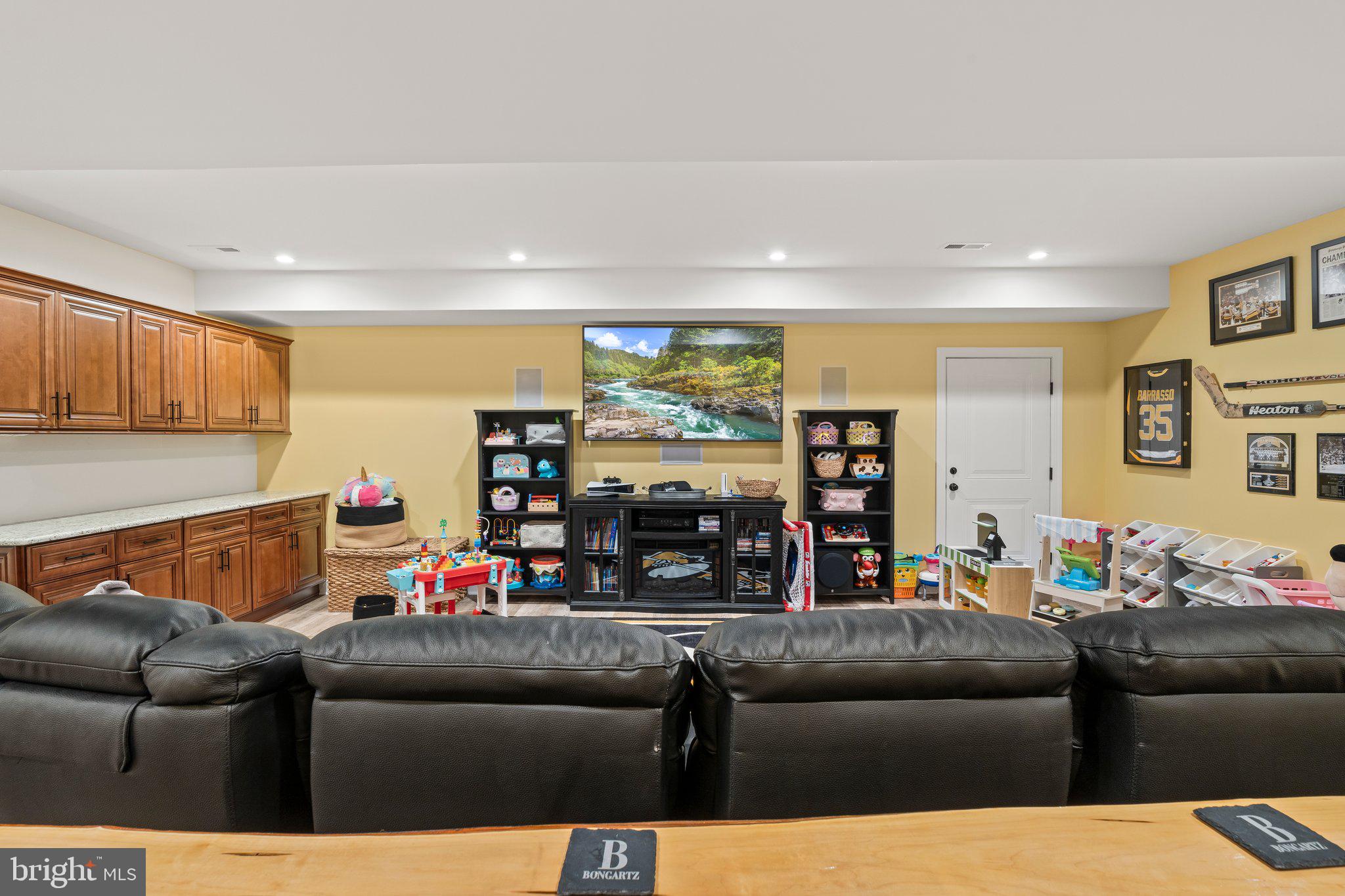 1413 Cortez Road Blue Bell, PA 19422 - Photo 45 of 66 a living room with furniture and a flat screen tv