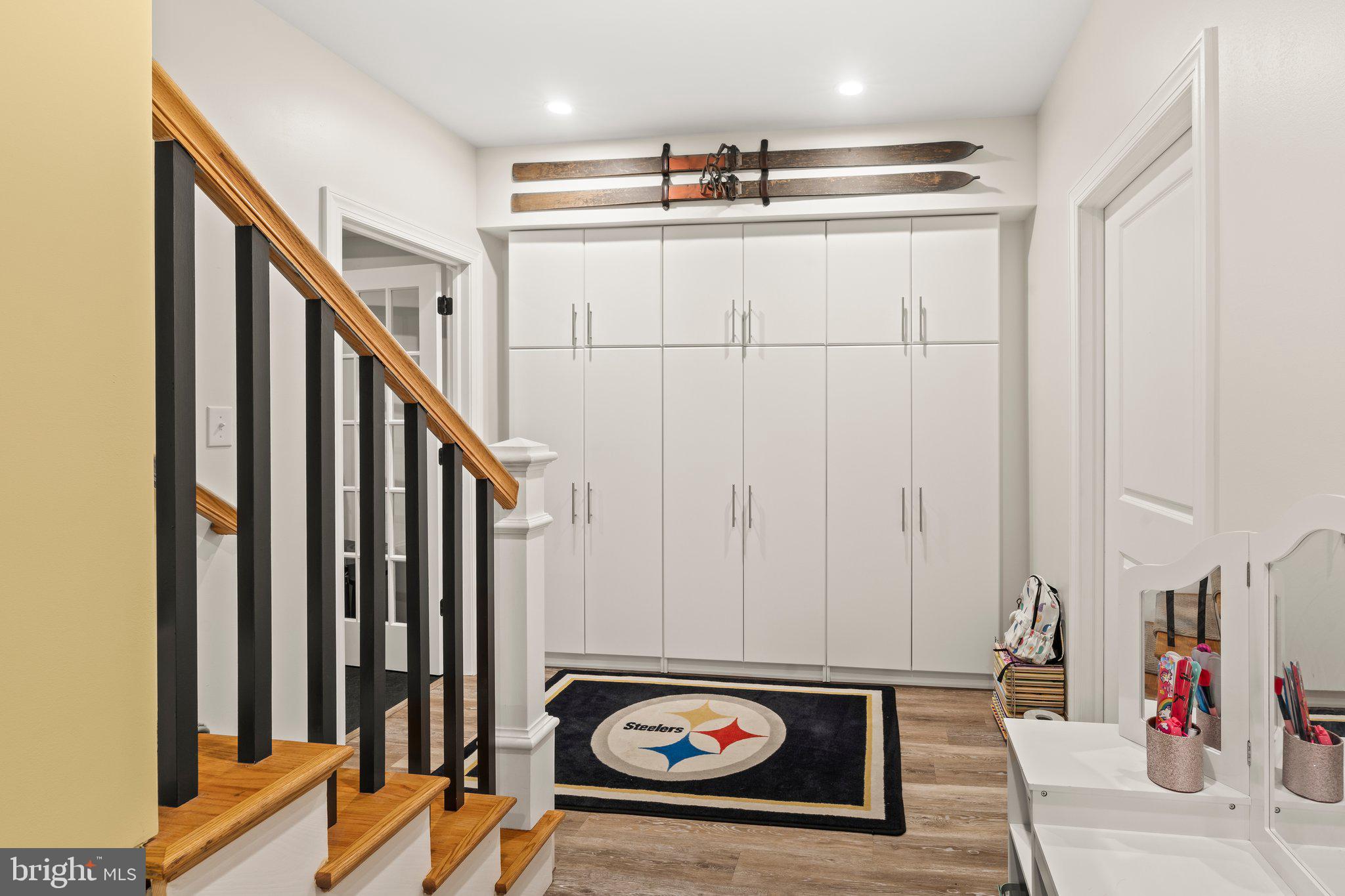 1413 Cortez Road Blue Bell, PA 19422 - Photo 46 of 66 a view of a room with wooden floor and stairs