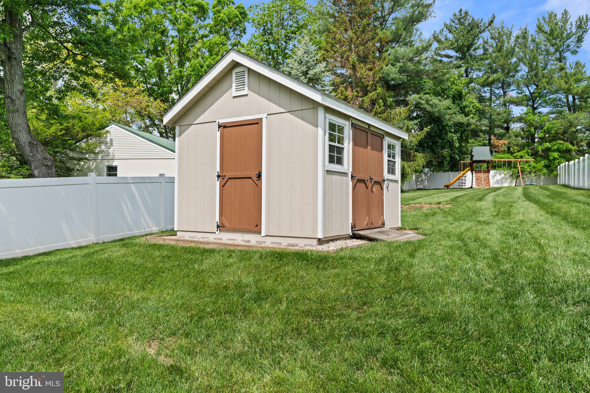 1413 Cortez Road Blue Bell, PA 19422 - Photo 54 of 66 a view of a backyard with plants and large tree