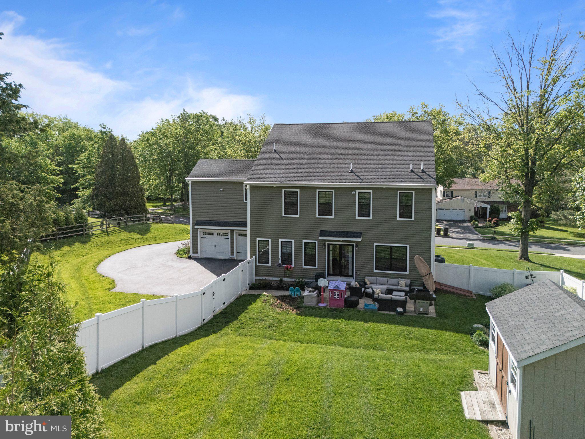 1413 Cortez Road Blue Bell, PA 19422 - Photo 60 of 66 a view of a house with a backyard patio and swimming pool