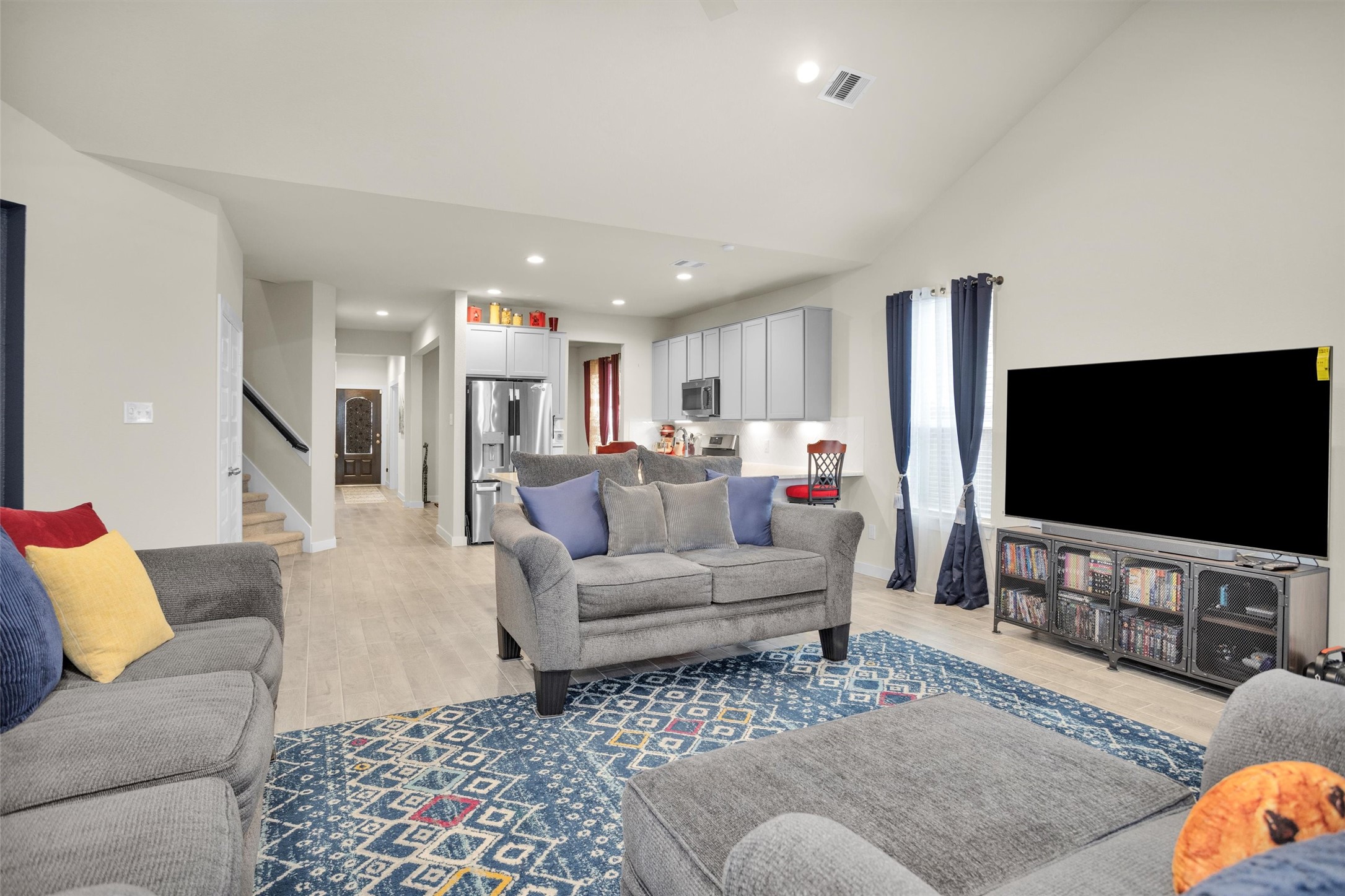 2210 Reed Cave Ln Spring Spring, TX 77386 - Photo 13 of 40 a living room with furniture and a flat screen tv