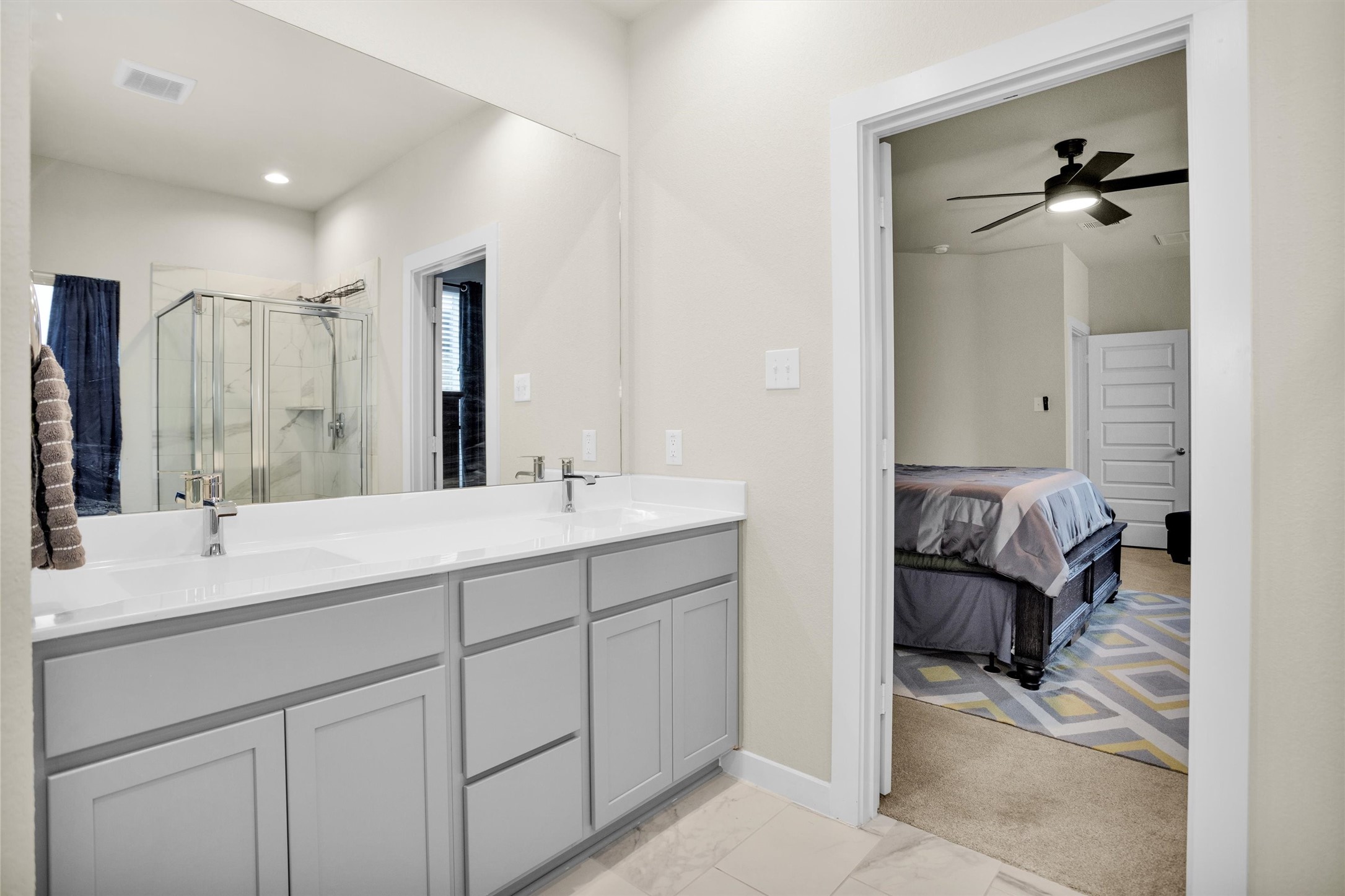 2210 Reed Cave Ln Spring Spring, TX 77386 - Photo 23 of 40 a en suite bathroom with a double vanity sink and mirror