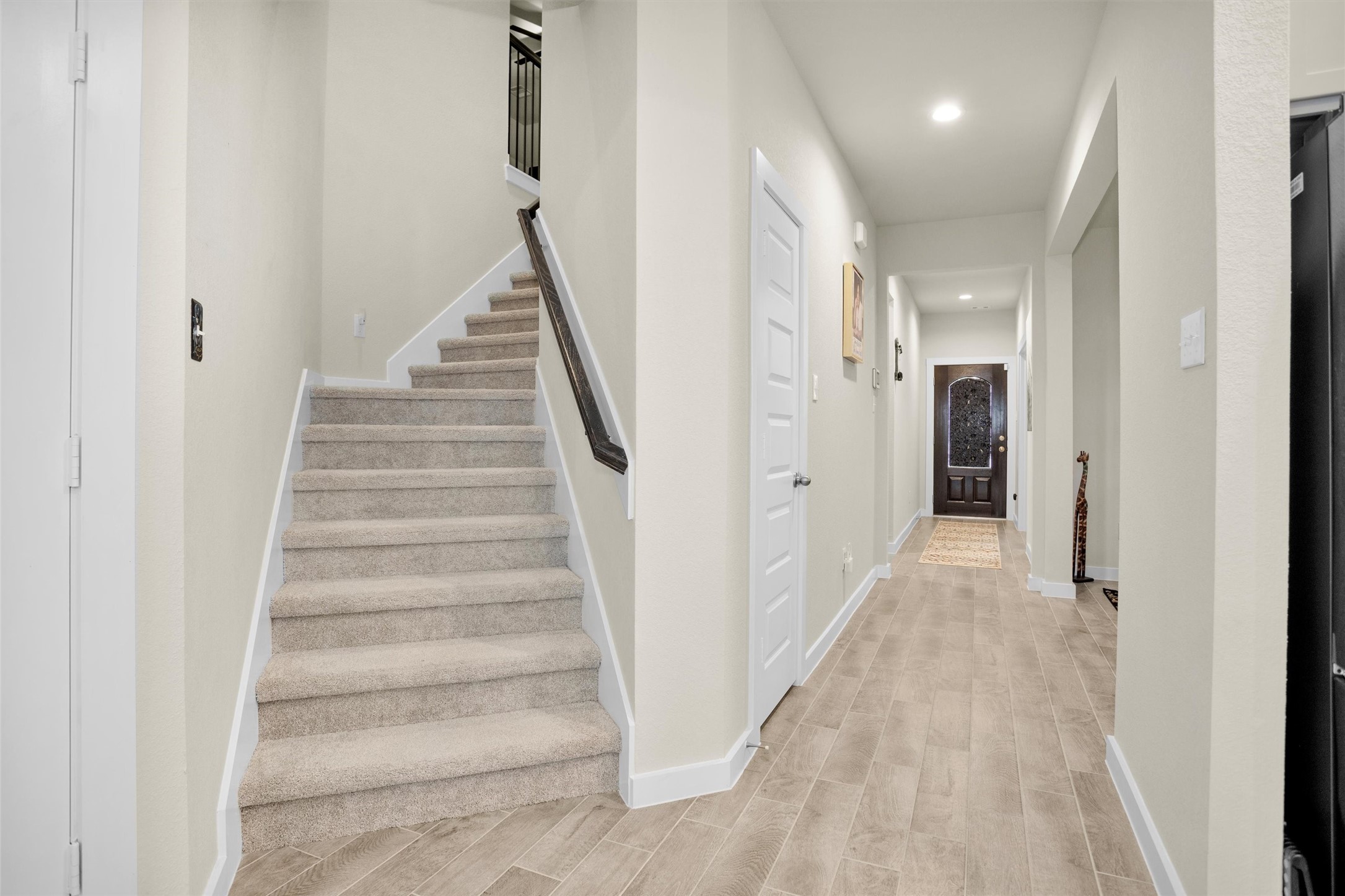 2210 Reed Cave Ln Spring Spring, TX 77386 - Photo 25 of 40 a view of a hallway with white walls and entryway