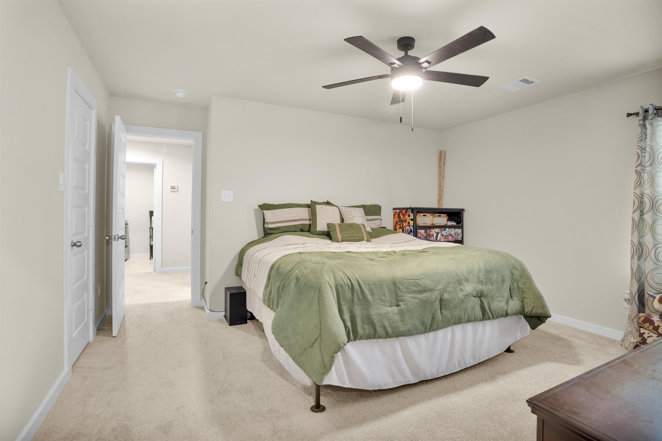 2210 Reed Cave Ln Spring Spring, TX 77386 - Photo 29 of 40 a bedroom with a bed and ceiling fan