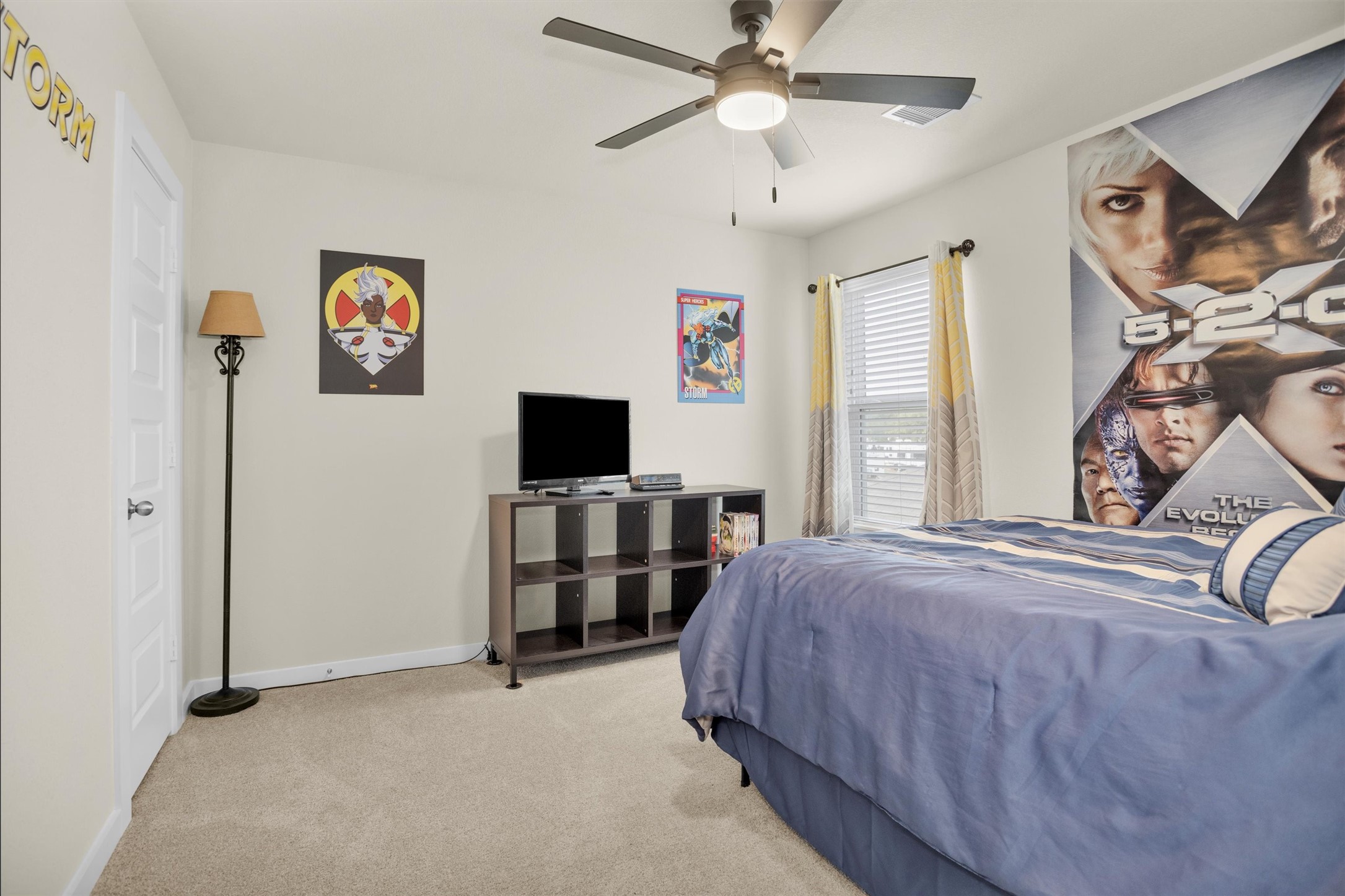 2210 Reed Cave Ln Spring Spring, TX 77386 - Photo 31 of 40 a bedroom with a bed and a flat screen tv