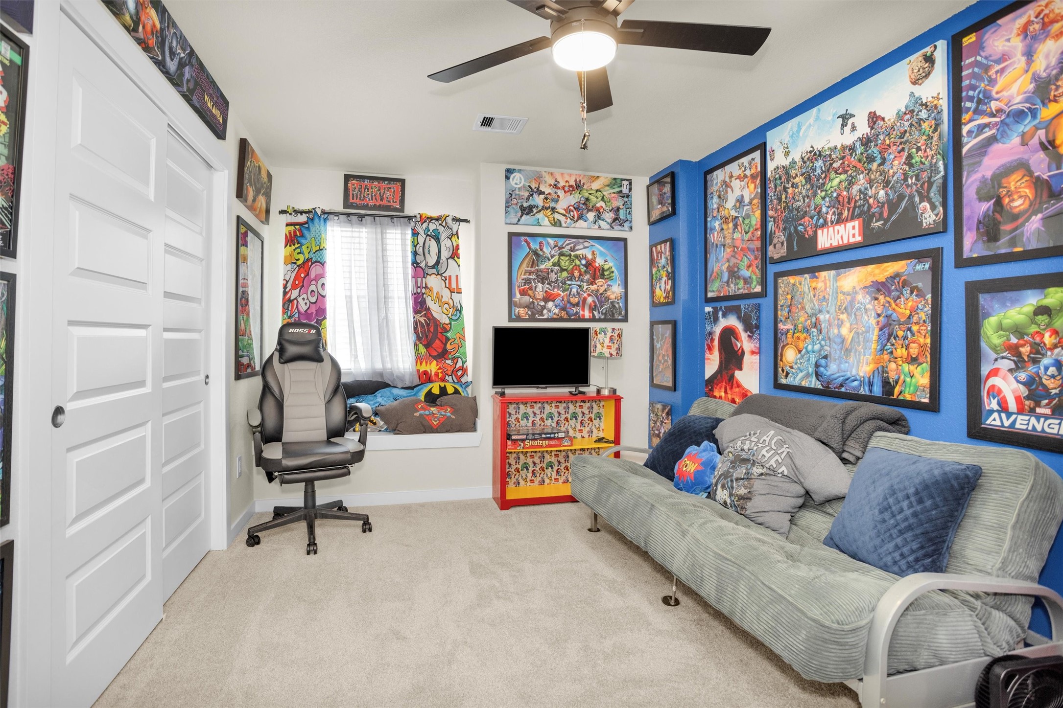 2210 Reed Cave Ln Spring Spring, TX 77386 - Photo 32 of 40 a living room with furniture and a flat screen tv