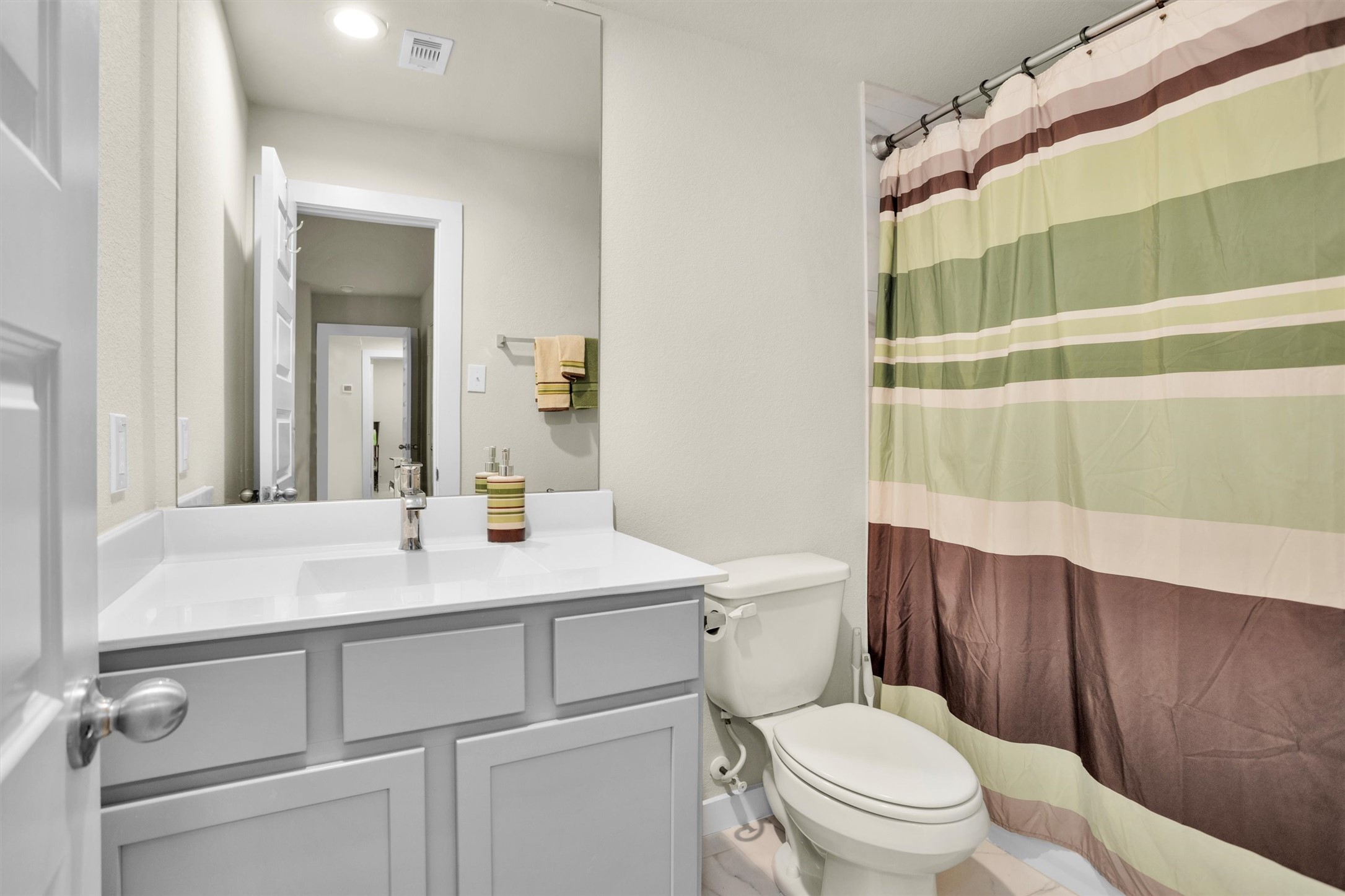 2210 Reed Cave Ln Spring Spring, TX 77386 - Photo 34 of 40 a bathroom with a sink a toilet a mirror and shower