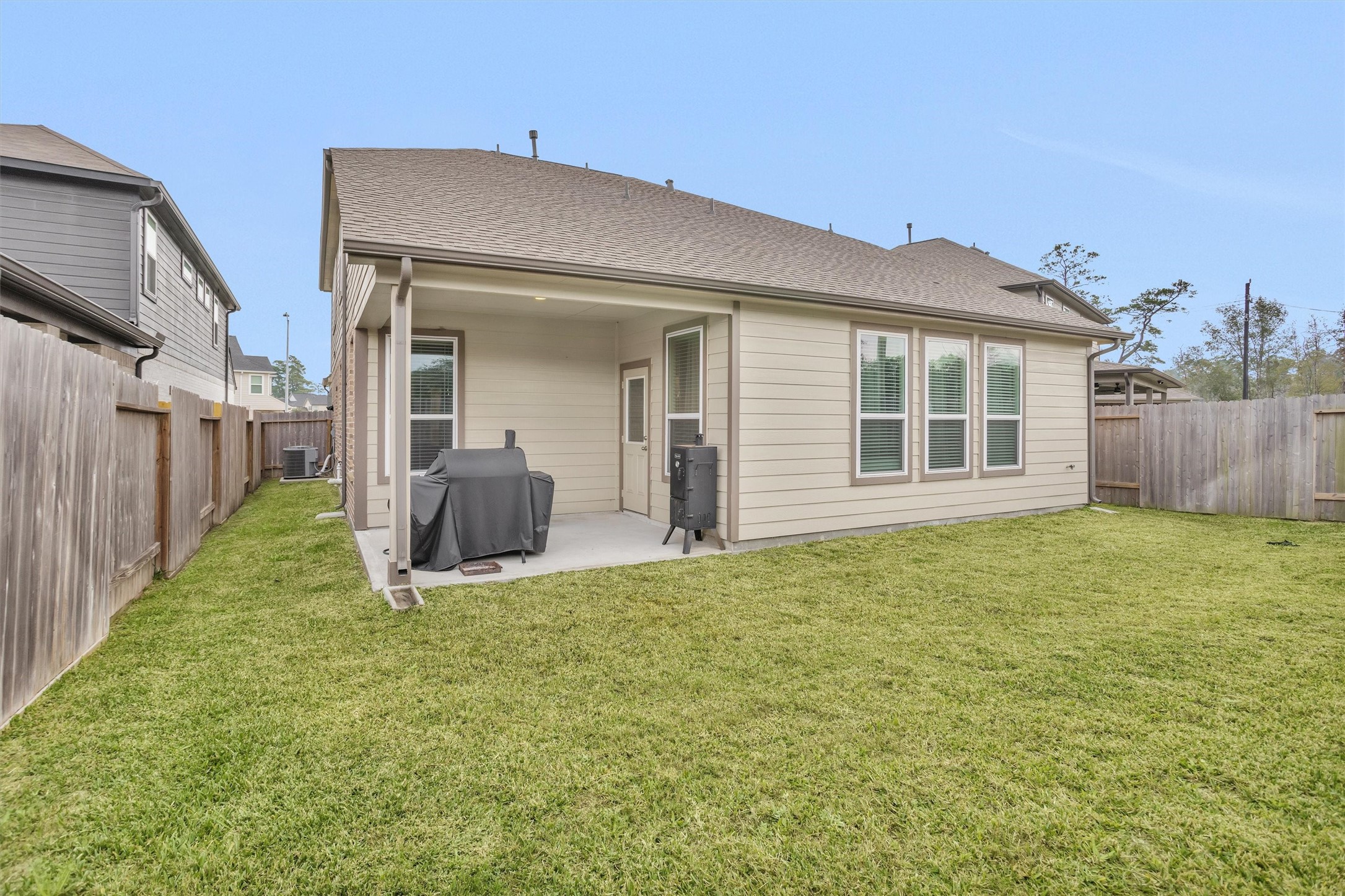 2210 Reed Cave Ln Spring Spring, TX 77386 - Photo 38 of 40 a view of a house with a yard and garage