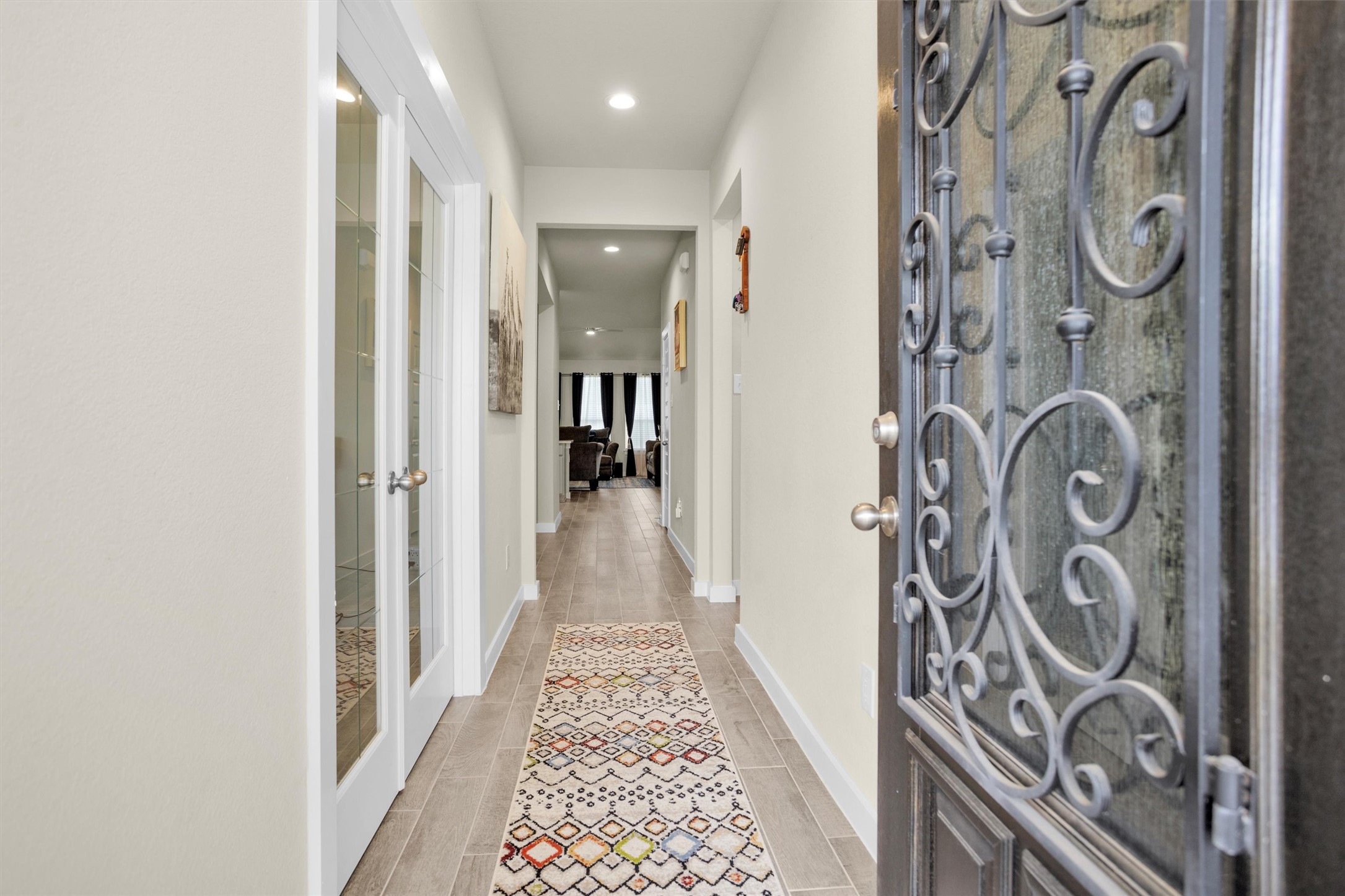 2210 Reed Cave Ln Spring Spring, TX 77386 - Photo 4 of 40 a view of a hallway with wooden floor