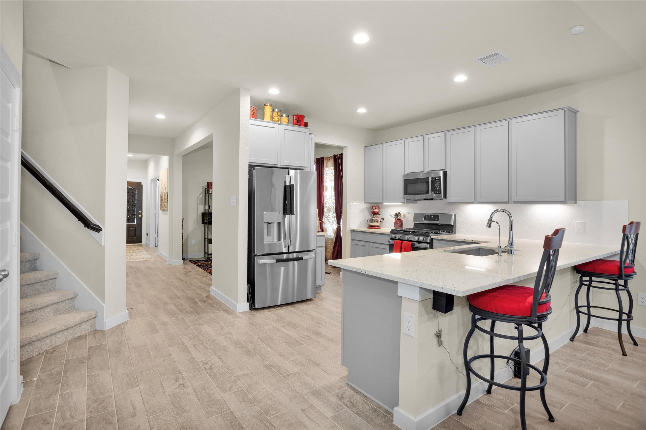 2210 Reed Cave Ln Spring Spring, TX 77386 - Photo 6 of 40 a kitchen with refrigerator and cabinets