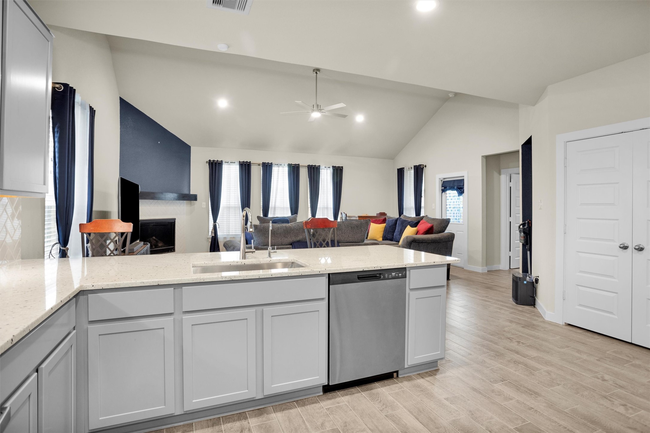 2210 Reed Cave Ln Spring Spring, TX 77386 - Photo 7 of 40 a large kitchen with kitchen island a sink stainless steel appliances and cabinets